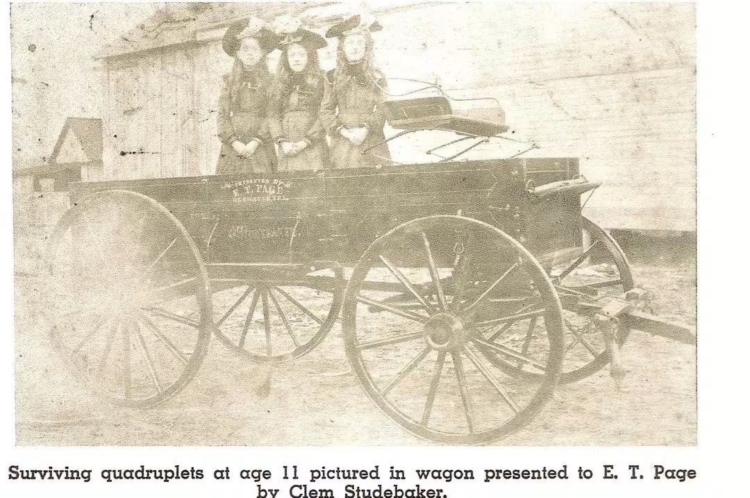 Surviving quadruplets at age 11 pose in a wagon gifted by Clem Studebaker, highlighting a unique moment in their lives.
