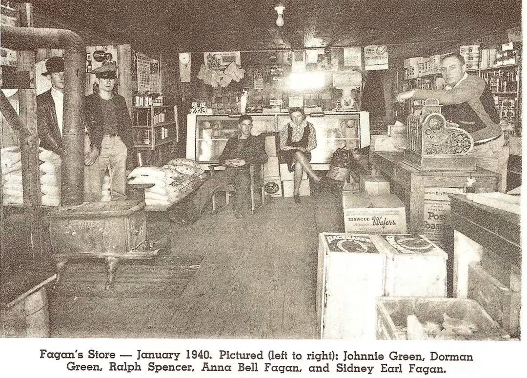 Fagan's Store, January 1940, showcases five individuals amidst shelves of goods, highlighting a historic retail atmosphere.